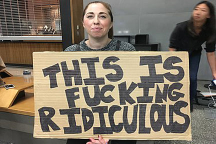 FDA won't regulate CBD Woman holding a sign saying this is Fucking ridiculous 